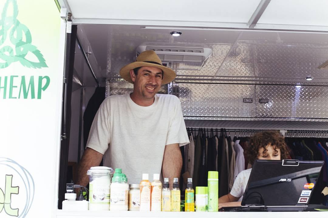Darius with his youngest son Gabe inside the Made In Hemp market trailer