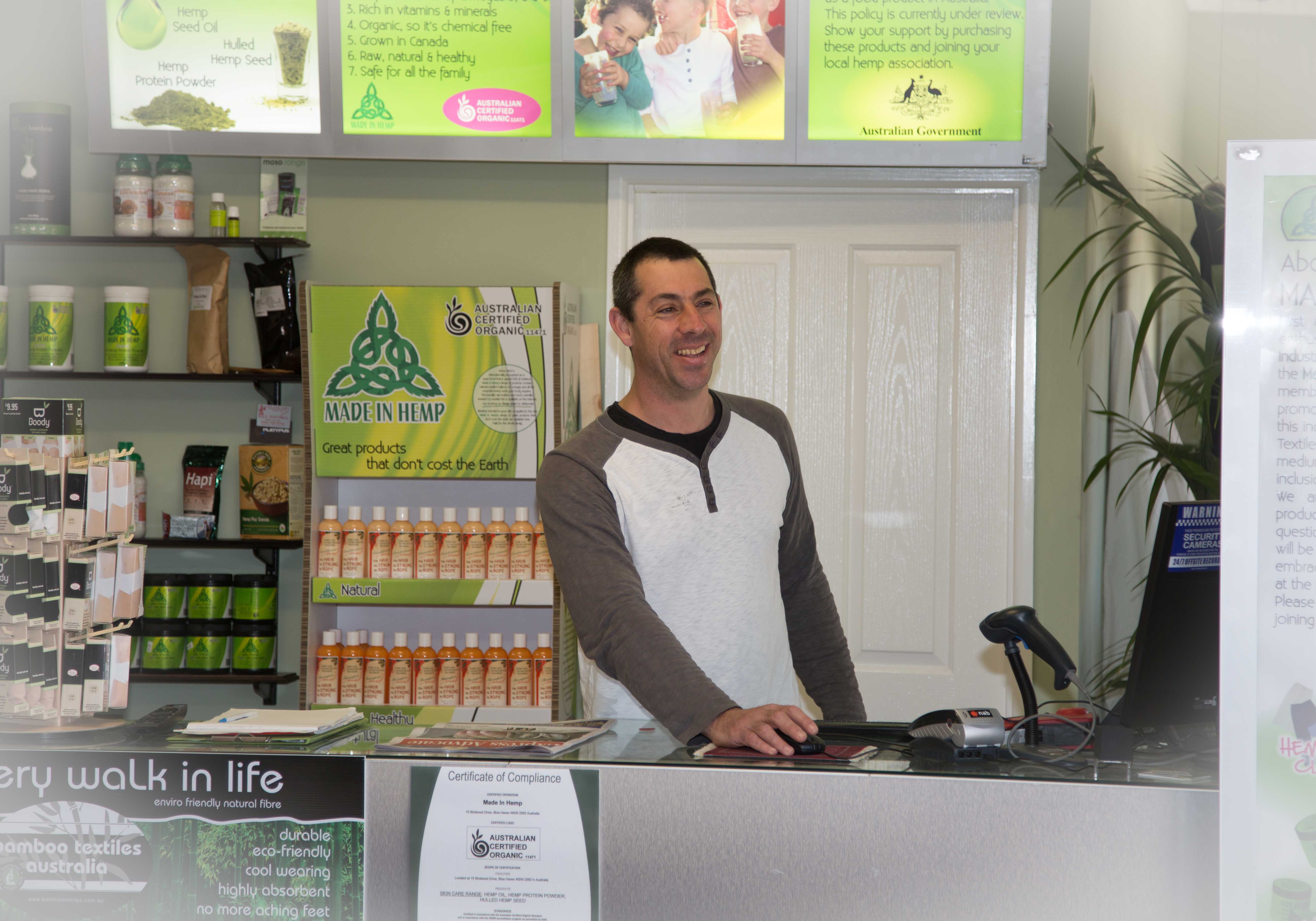 Darius behind the counter at Made In Hemp Long Jetty during opening week in 2013